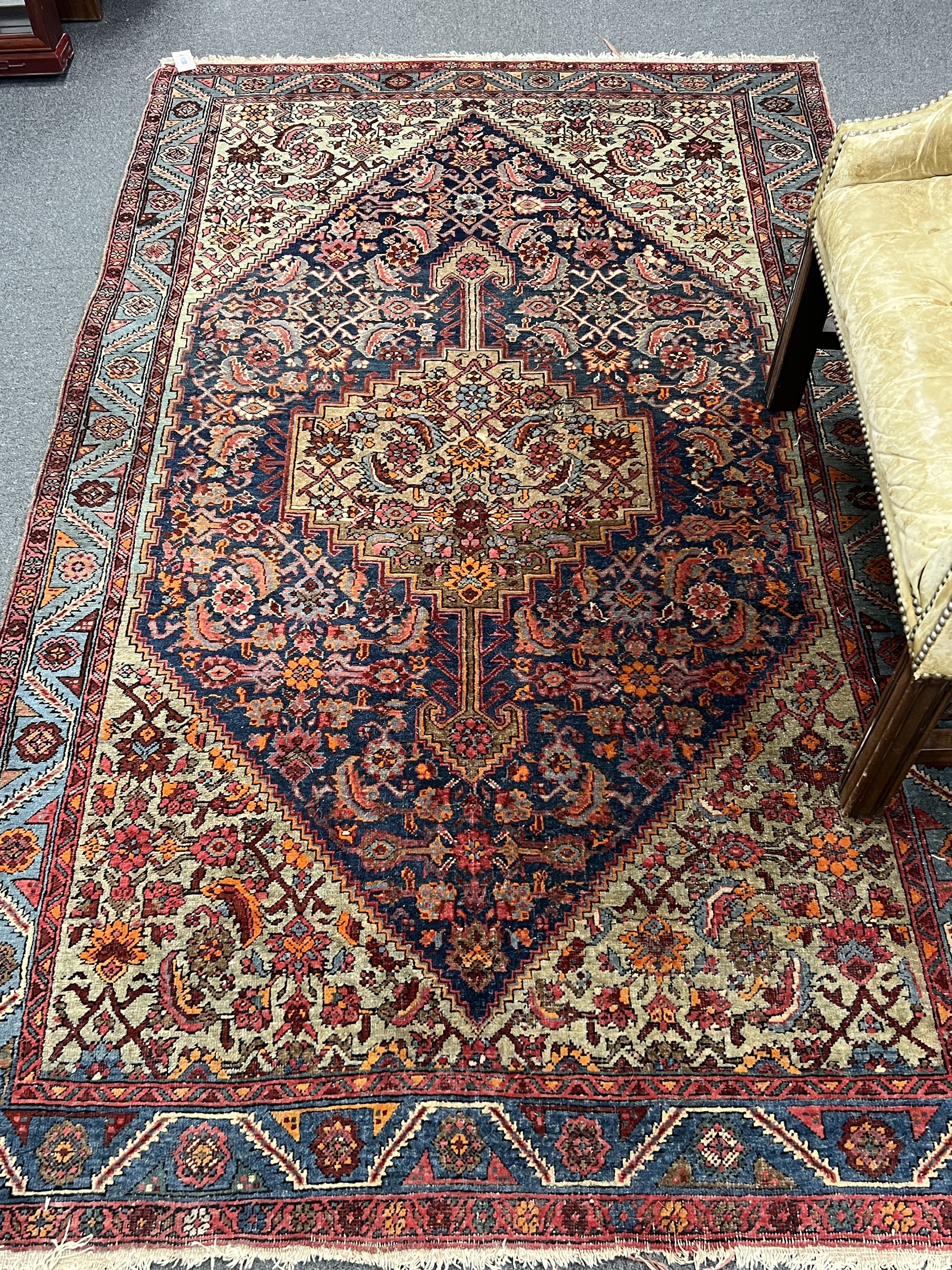 A North West Persian blue ground rug, 210 x 125cm